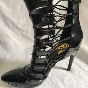 Sexy black lace up booties.